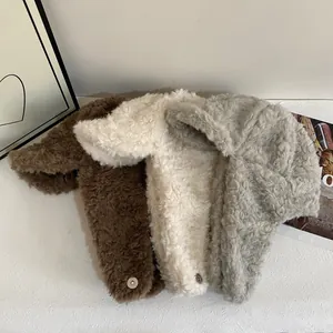 Plush winter trapper hat set in cream, brown, and grey with warm earflaps and metal snaps