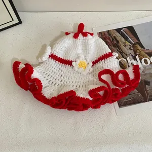Handmade crochet flower knit hat with red ruffled brim and pompom for women in winter