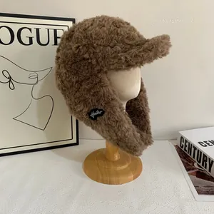Cozy dark brown fuzzy trapper hat with earflaps and plush faux fur for winter warmth