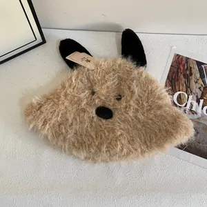 Close-up of warm brown plush dog ear bucket hat featuring soft faux fur texture