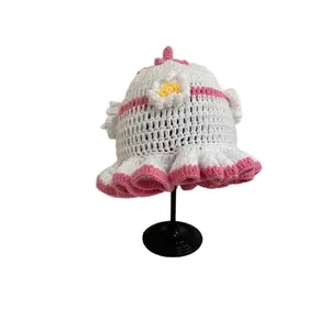 Handmade crochet knit flower hat for women with pink ruffled edges and floral detail