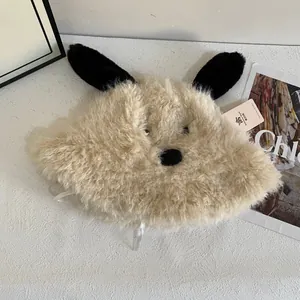Close-up of cute plush dog bucket hat with long black ears and soft curly faux fur material
