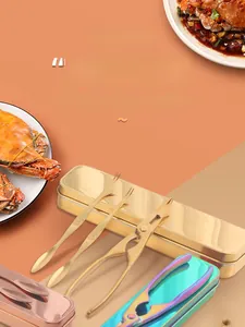 Close-up of 304 stainless steel crab tools including cracker and needle in gold color