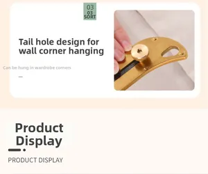 Detail view of the brass utility knife featuring a tail hole design for hanging storage