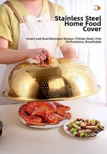 Close-up of golden stainless steel food cover with mesh holes being placed over a meal