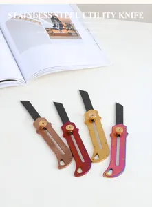 Utility knives in bronze, red, gold and iridescent finishes with a lifestyle magazine