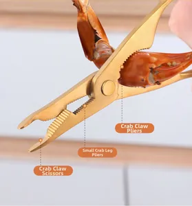 Close-up of gold-plated 304 stainless steel tool cracking a crab leg with three functions