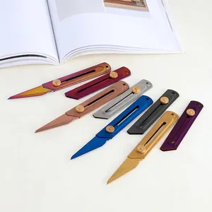 Set of 7 colorful stainless steel mini utility knives with sliding retractable blades