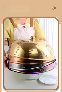 Detailed stack of multi-colored stainless steel mesh food covers with gold top handles