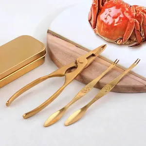 Golden 304 stainless steel crab cracker set with engraved floral patterns on three pieces