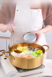 Detail of 304 stainless steel dual-sided hot pot with induction base and soup ladle
