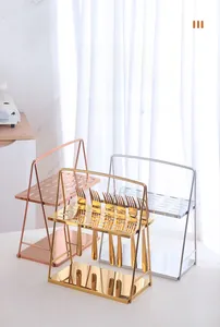 Detail of multi-color stainless steel cutlery rack for drying knives and forks