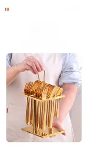 Polished gold stainless steel cutlery set with a stylish two-tier storage rack and handle
