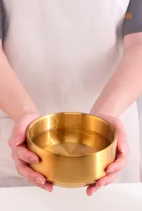 Macro view of gold 304 stainless steel bowl with double-wall heat insulation