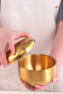Macro detail of the brushed gold 304 stainless steel bowl with double-layer lid