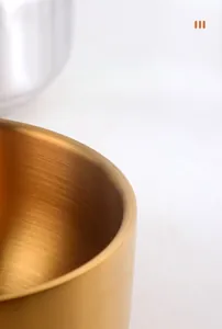 Detail of 304 stainless steel bowl showing golden brushed texture and rounded edges