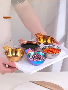 Close-up of bear-shaped stainless steel dipping bowls in five metallic finishes on tray