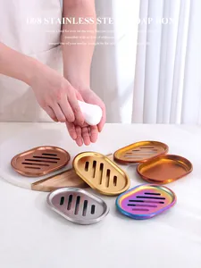 Detailed macro view of multi-colored 18/8 stainless steel soap boxes with drainage slots