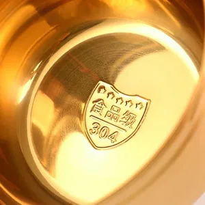 Close-up of golden food-grade 304 stainless steel lunch box showing bottom material stamps