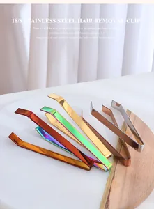 Detailed view of colorful SUS 304 stainless steel kitchen tweezers on a marble display