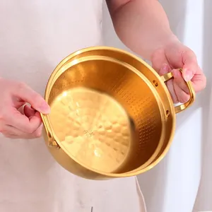Golden 304 stainless steel ramen pot with dual handles and honeycomb interior texture