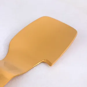 Brushed gold 304 stainless steel pomelo opener and citrus peeler tool on stone surface