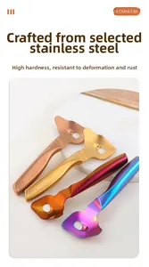 Close-up of four colorful ergonomic stainless steel gua sha massage tools on marble