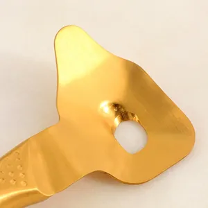 Golden stainless steel noodle slicer with brushed finish and ergonomic textured handle