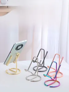 Minimalist metal wire phone stands in gold, silver, black, and rose gold plating