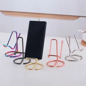 Minimalist metal desktop phone stand in five electroplated colors with circular base