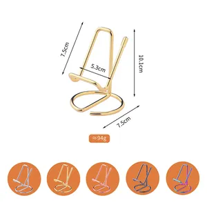 Minimalist metal wire desktop stand for mobile phones and tablets in golden finish