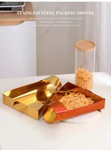 Close-up of golden and bronze stainless steel food scoops for dry goods and cereals