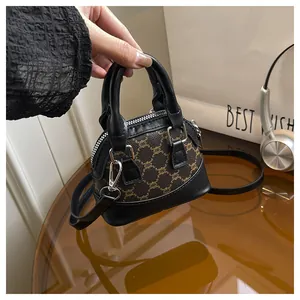 Detail of mini shell bag showing vintage chain pattern and high-quality leather texture