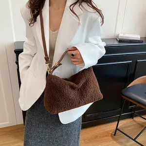 Brown fuzzy crossbody bag for women with leather strap and zipper closure for winter