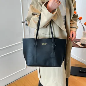 Classic black leather tote bag with gold lettering for women's stylish daily commute