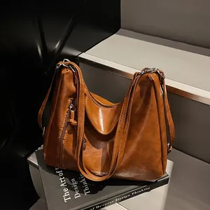 Retro caramel brown leather tote bag with double straps and side zipper detail for work