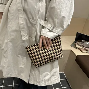 Chic quilted knit clutch bag in brown and beige diamond pattern for elegant women