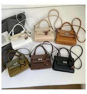 Collection of six elegant crossbody bags featuring woven V-pattern flaps and heart charms