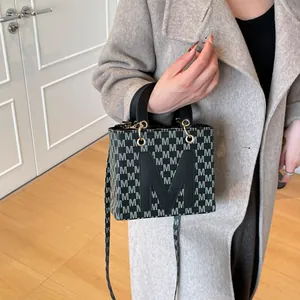 Chic grey monogram pattern square handbag with gold hardware for women's crossbody wear