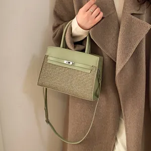 Elegant light green and beige patchwork leather handbag with woven texture and top handle