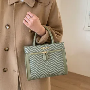Sac à main vert à motif pied-de-poule avec zips dorés et poignée supérieure pour femme