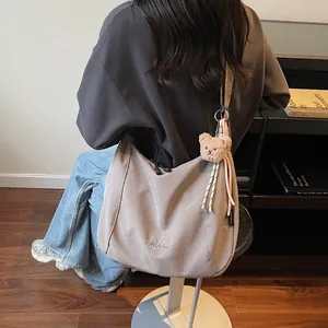 Minimalist dark gray canvas tote bag with Midola embroidery and a cute bear charm