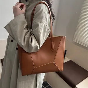 Brown vintage leather tote bag with geometric stitching for women's daily commute
