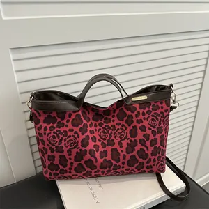 Tote bag with pink leopard rose floral pattern and dark brown leather straps
