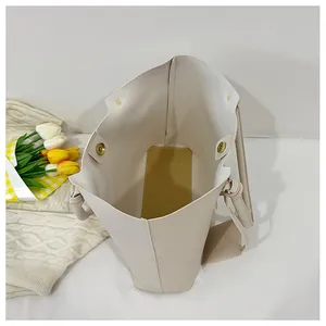 Interior view of minimalist tote bag with dual magnetic closures and reinforced base