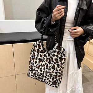 Leopard print plush bucket bag with woven handles shown with a stylish casual outfit