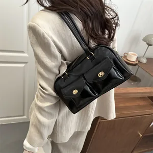 Chic black glossy leather pillow bag for women featuring dual front flap pockets