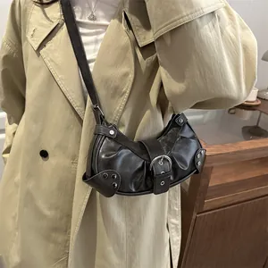 Chic black motorcycle hobo bag with silver studs and buckles for a Y2K aesthetic look