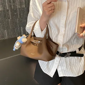 French style brown pebble leather bucket bag with cute bear charm and metal buckle