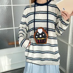 Cute cupcake shaped mini crossbody bag with heart detail and slim shoulder strap
